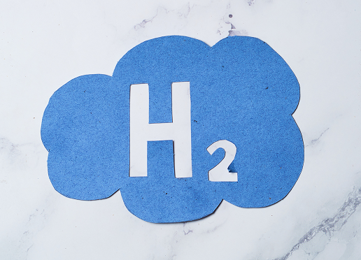 H2 symbol highlighting green hydrogen steel production process