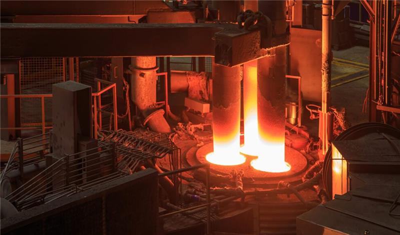 Green Hydrogen Steel Production in an industrial furnace with molten metal pouring